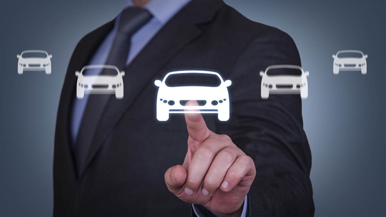 A person touching a car icon on a screen