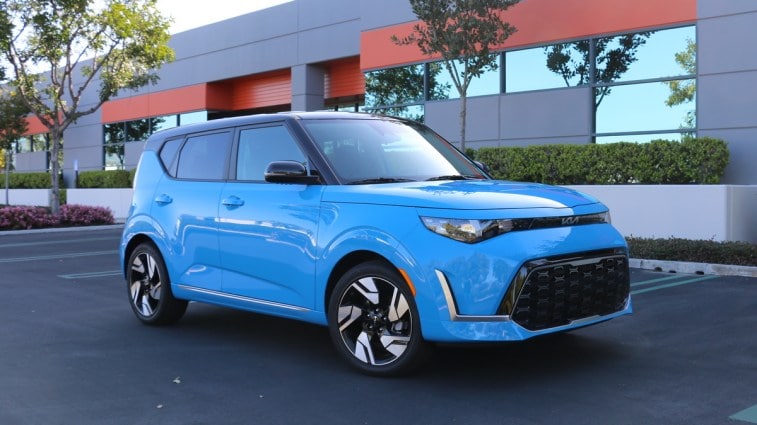 Blue 2023 Kia Soul GT-Line near a building.