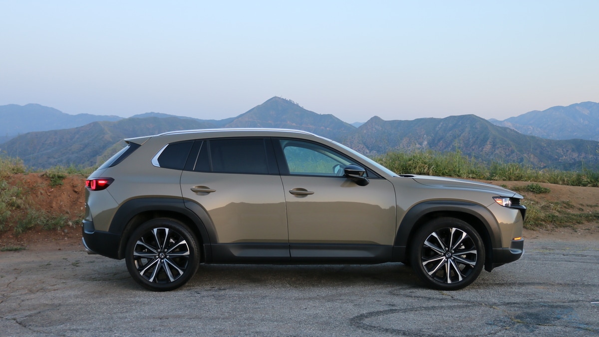 2023 Mazda CX-50 with mountains in the background.