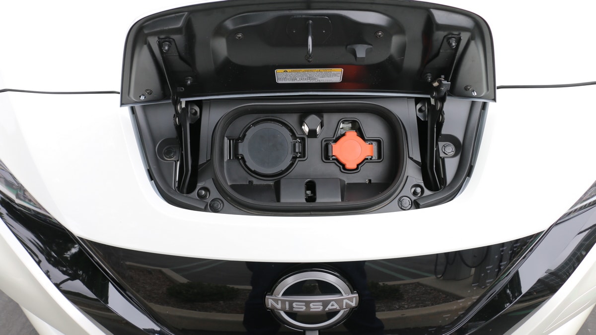 White 2023 Nissan Leaf charge port.