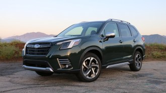 Green 2023 Subaru Forester Touring at GMR at sunrise.