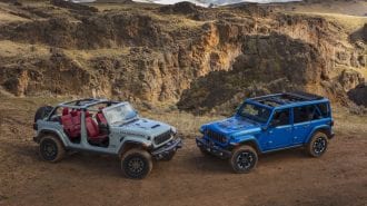 A pair of redesigned 2024 Jeep Wranglers showing roof options