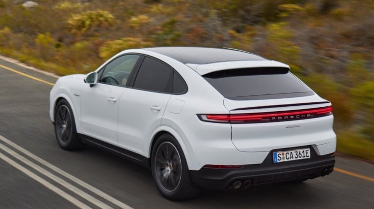 The 2024 Porsche Cayenne seen from a rear quarter angle