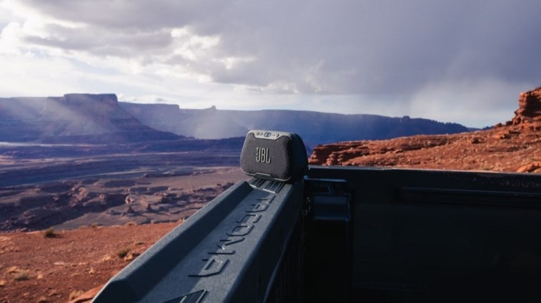 A teaser photo showing a Bluetooth speaker on the tailgate of the 2024 Toyota Tacoma