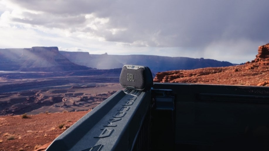 A teaser photo showing a Bluetooth speaker on the tailgate of the 2024 Toyota Tacoma