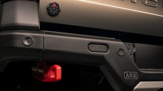 A teaser photo showing the rear bumper of the 2024 Toyota Tacoma Trailhunter