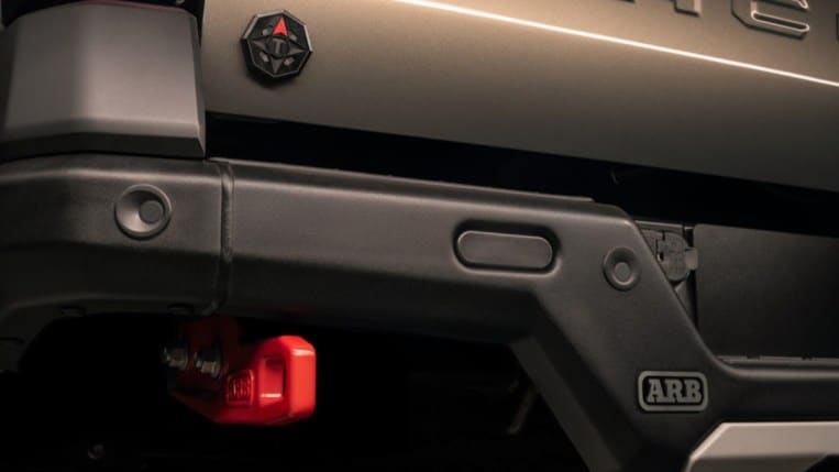 A teaser photo showing the rear bumper of the 2024 Toyota Tacoma Trailhunter