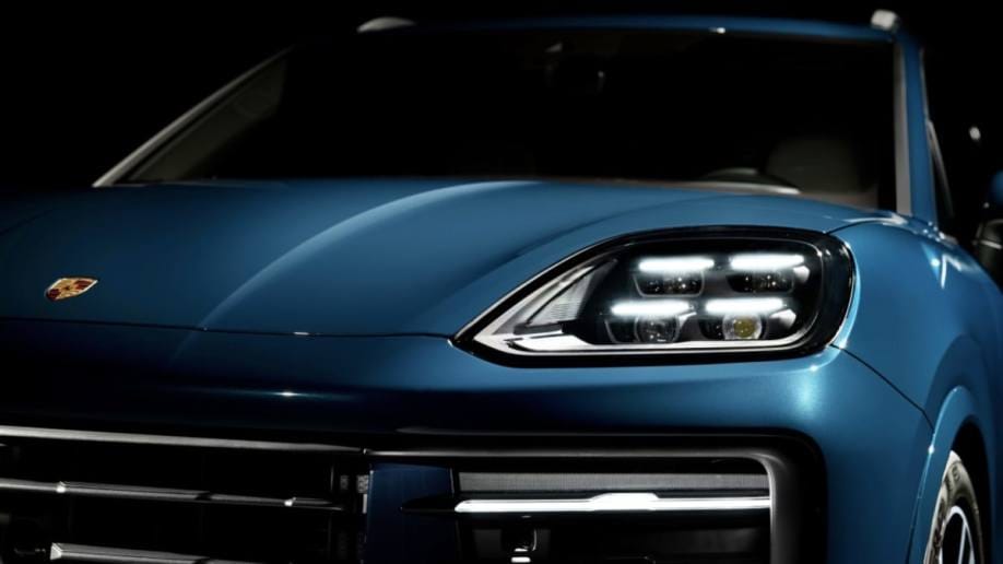 A teaser image showing a detail of the 2024 Porsche Cayenne