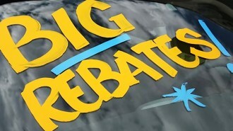 Rebates advertised on car windshield
