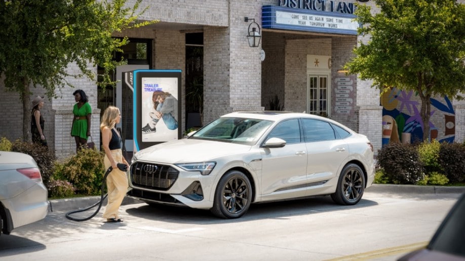 A customer charges at a Volta destination charger