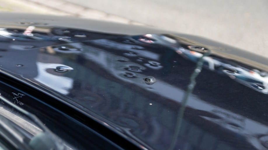 Dents from hail damage on a car hood