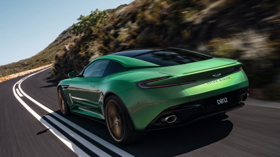 The 2024 Aston Martin DB12 seen from a rear angle