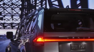 A teaser photo showing the 2024 Lexus GX from a rear quarter angle