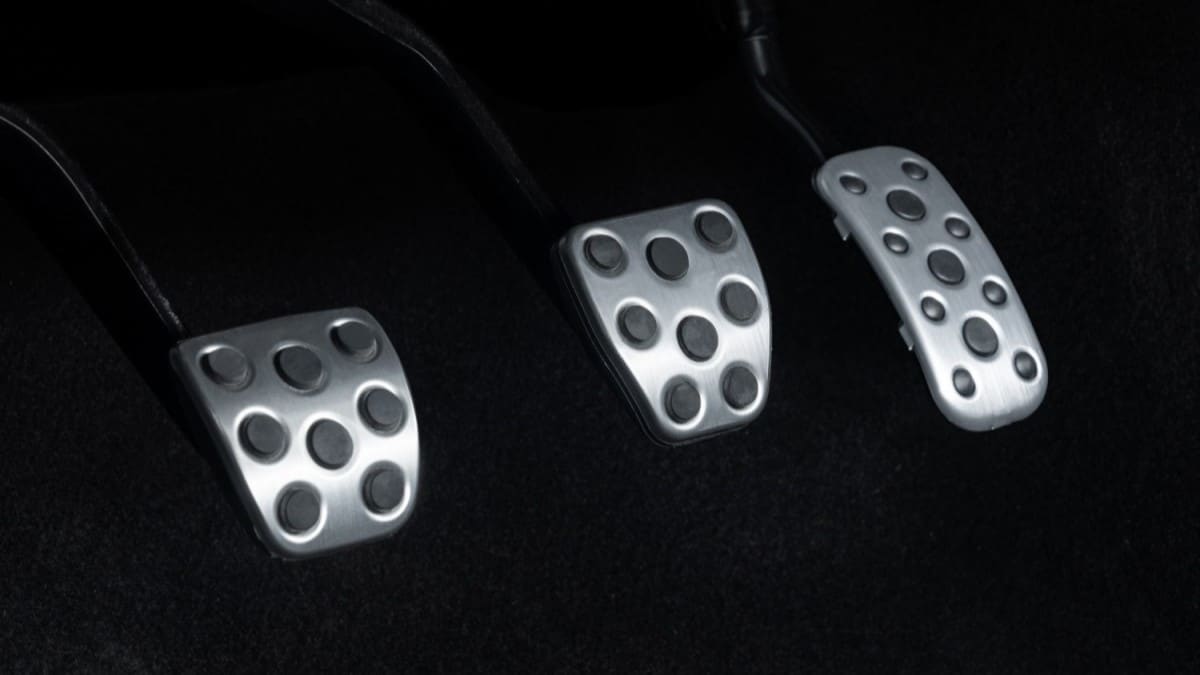 A teaser photo showing three pedals in the 2024 Toyota Tacoma midsize truck