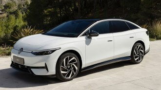 White 2025 Volkswagen ID.7 parked on a driveway.