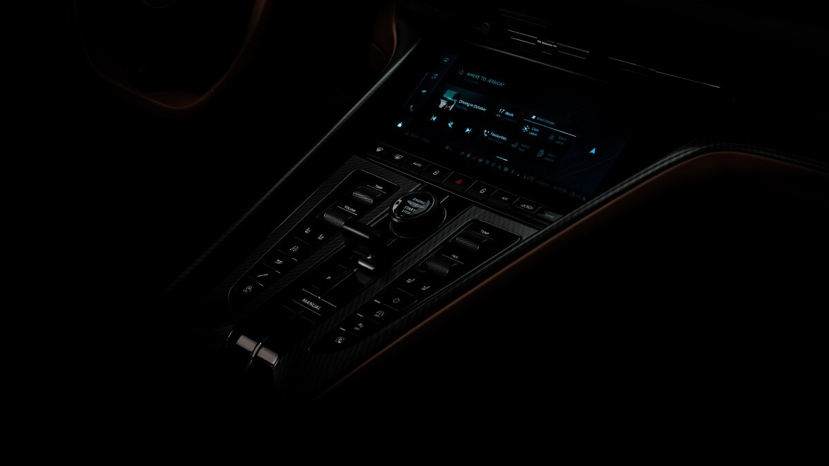 A teaser photo showing the center console of the next Aston Martin DB