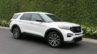2022 Ford Explorer ST Line in white near green wall.