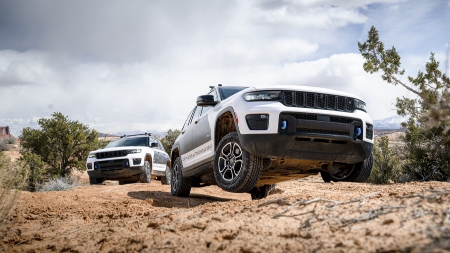 A pair of Jeep Grand Cherokee 4xe SUVs testing autonomous off-road driving technology