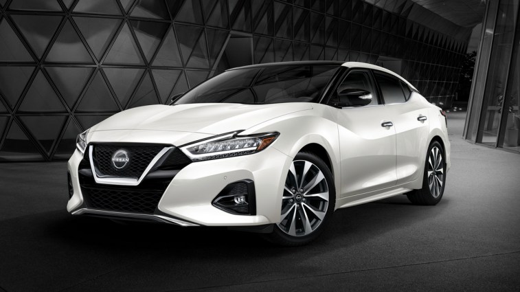 2023 Nissan Maxima in white near a building.