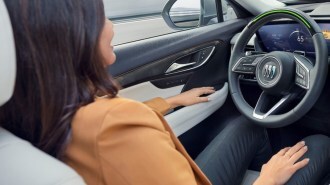 The driver of a 2024 Buick Envision with their hands off the steering wheel