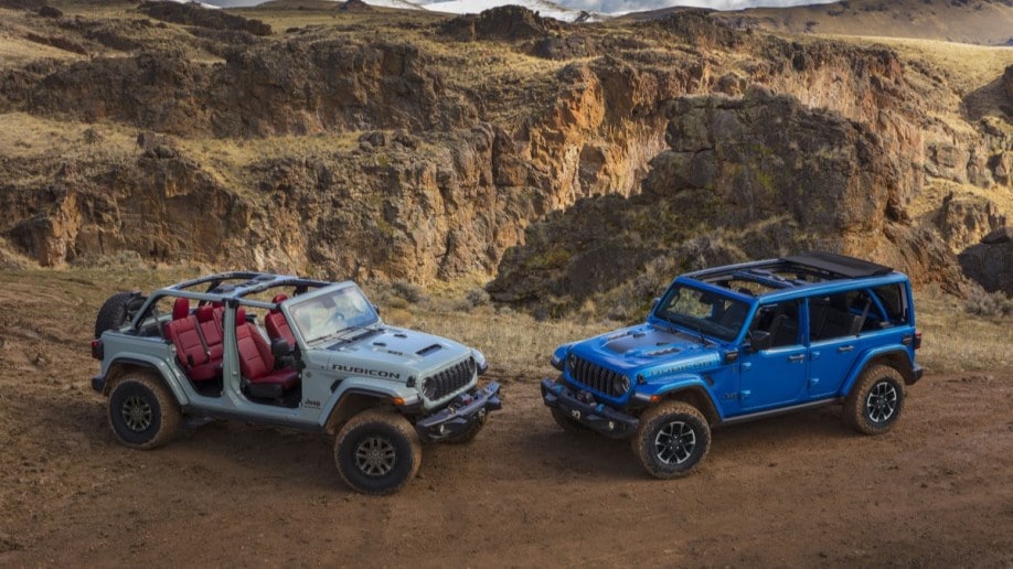A pair of redesigned 2024 Jeep Wranglers showing roof options
