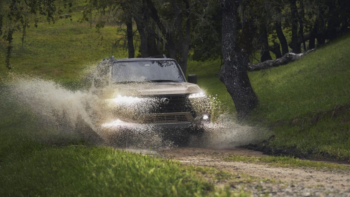 The 2024 Lexus GX splashes through a puddle