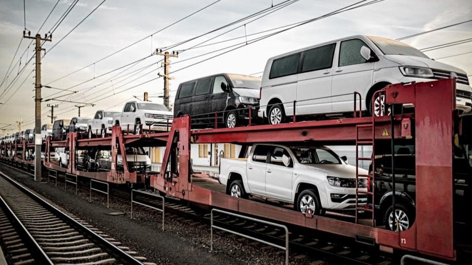 A train carrying cars 