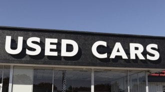 A used car sign on a dealership