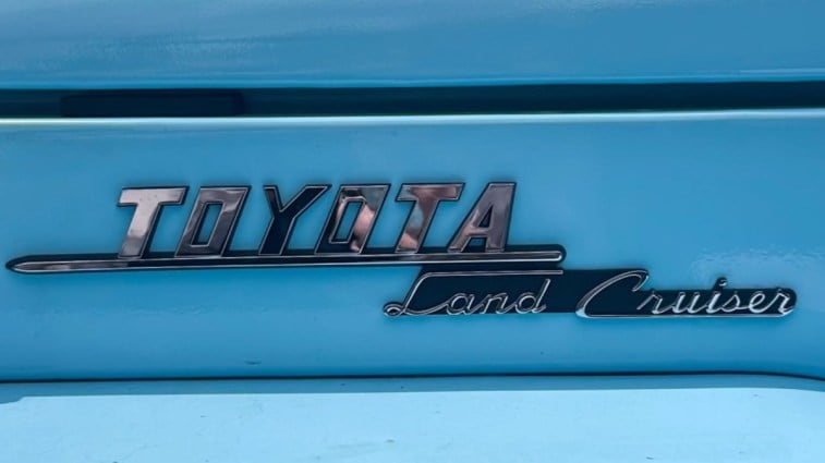 A teaser image Toyota released showing a classic Land Cruiser badge