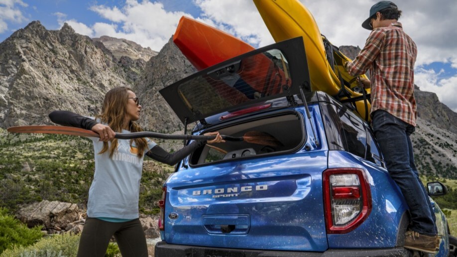 The 2023 Ford Bronco Sport seen from the rear, loaded with kayaks
