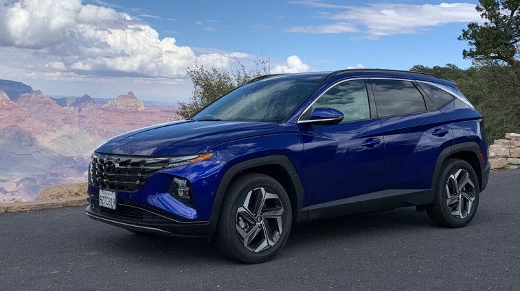 2023 Hyundai Tucson in blue at the rim of the Grand Canyon.