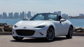 2023 Mazda MX-5 Miata in white near the harbor.