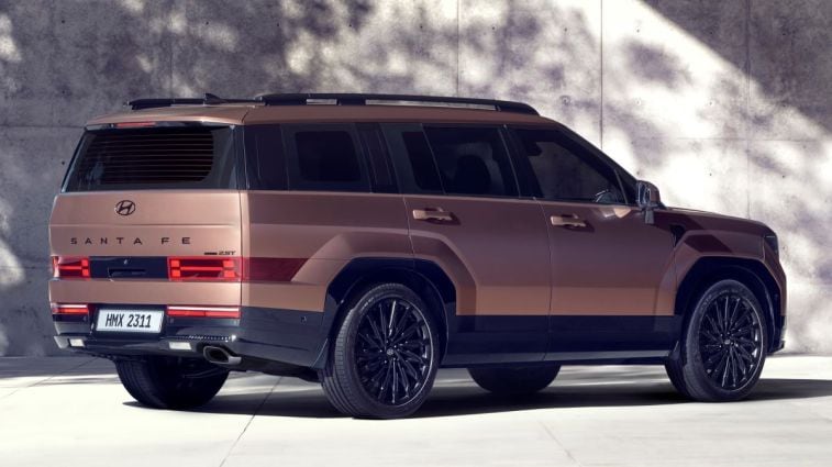 Rear view of the redesigned 2024 Hyundai Santa Fe in bronze