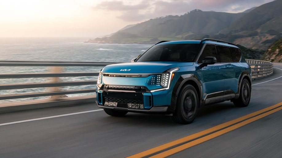 2024 EV9 GT-Line driving on road by ocean