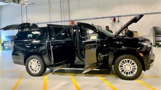 The GM Defense Heavy Duty SUV with all its armored doors open