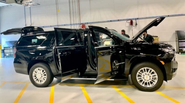 The GM Defense Heavy Duty SUV with all its armored doors open