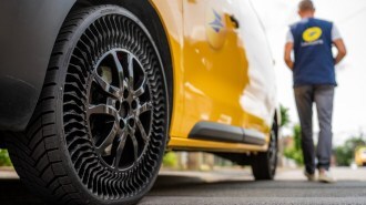 An airless Michelin Uptis tire on a French postal service van