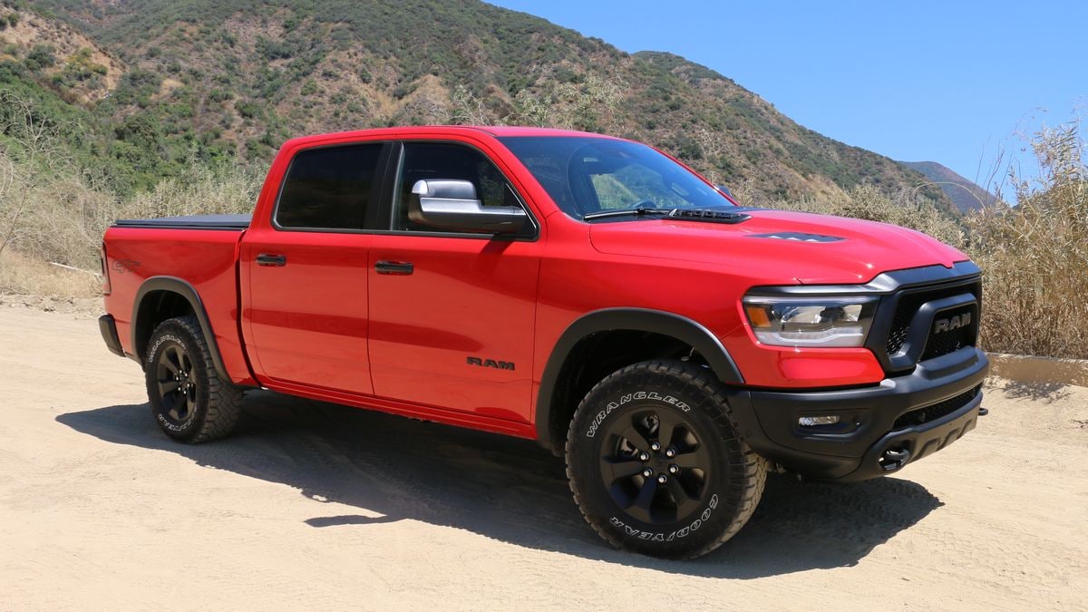 2023 Ram 1500 Rebel G/T in red with hills in the background.