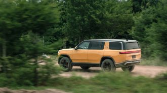 The Rivian R1Ss seen from a rear quarter angle