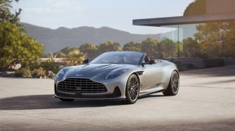 The Aston Martin DB12 Volante seen from a front quarter angle