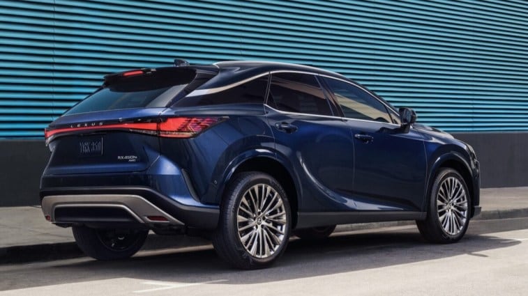The 2024 Lexus RX 450h+ seen from a rear quarter angle