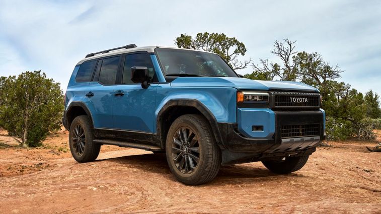 2024 Toyota Land Cruiser in blue on flat rock.