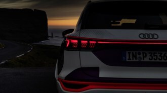 The taillights of the Audi Q6 E-Tron prototype signaling to a following driver