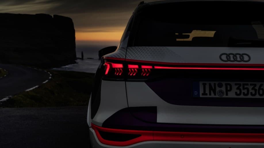 The taillights of the Audi Q6 E-Tron prototype signaling to a following driver