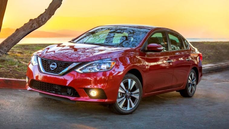 2016 Nissan Sentra in red at sunset.
