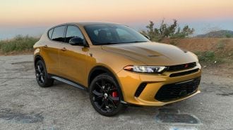 2024 Dodge Hornet RT PHEV in gold at sunrise on GMR.