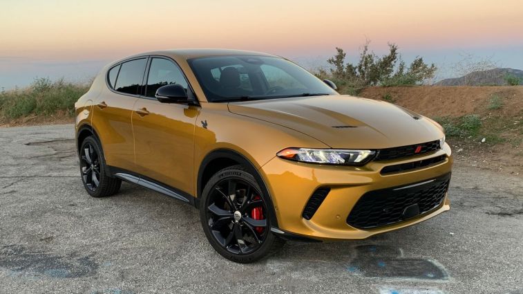 2024 Dodge Hornet RT PHEV in gold at sunrise on GMR.