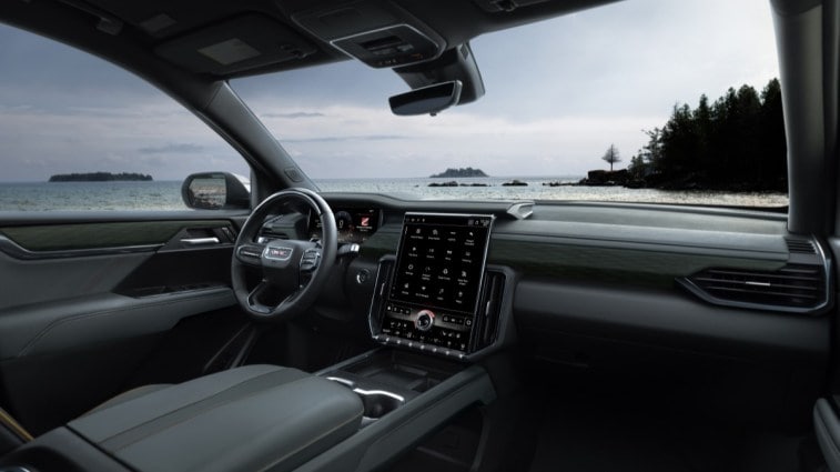 The 2024 GMC Acadia seen from a rear quarter angle