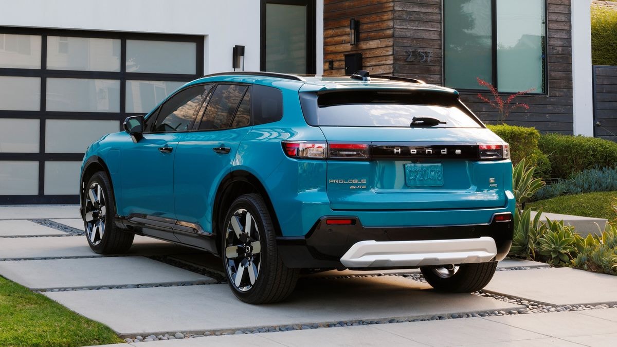 2024 Honda Prologue Elite in blue rear 3qtr parked in a driveway.