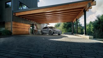 A 2024 Hyundai Ioniq 6 charging in a carport